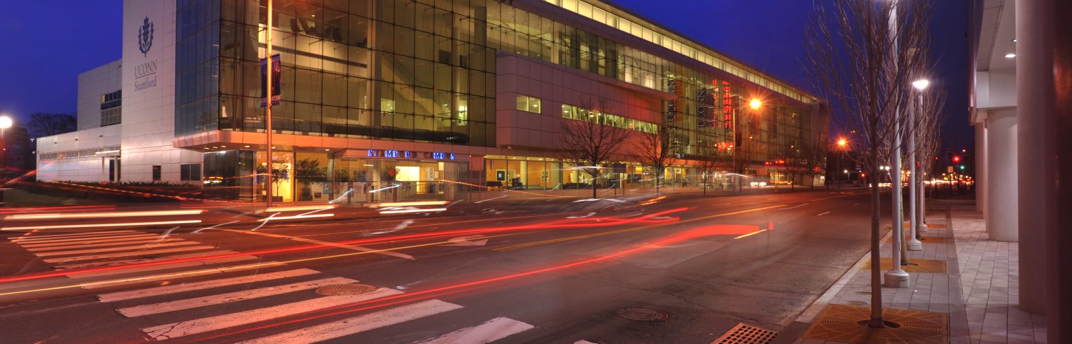 An exterior view of the Stamford Campus at night